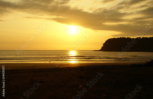 sunset on the beach in north goa