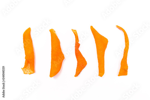 Dried orange peels isolated on a white background, close-up	
