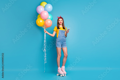 Full length body size view of her she nice attractive lovely cheerful girl standing on skaters free time celebratory isolated on bright vivid shine vibrant blue green teal turquoise color background © deagreez