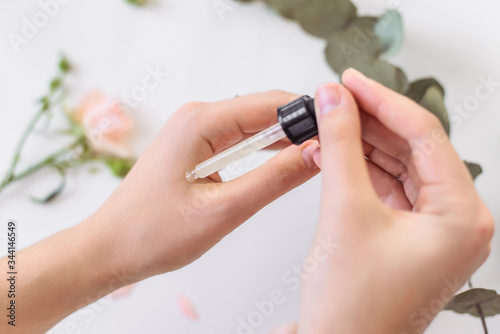 Moisturizing serum  hand application. Beautiful layout of natural cosmetics.