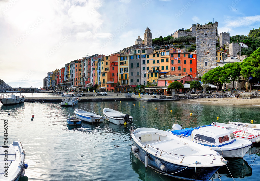 
Panorama of the middle-aged town of Portovenere. Colorful houses in Italian style. Harbor with fishing boats and yachts. Sea coast in Cinque Terre.