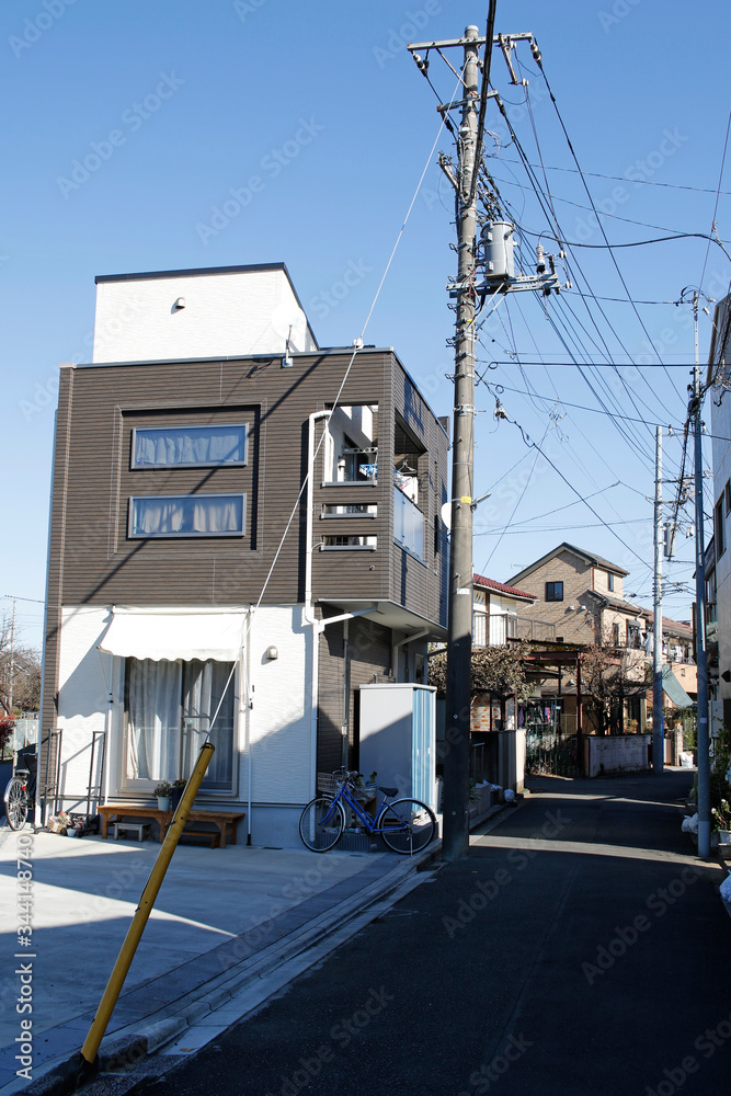 Narrow street with residential houses in the suburbs of Hibarigaoka, Nishitokyo, Tokyo, Japan
