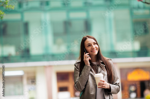 girl chatting on the phone  on business center background