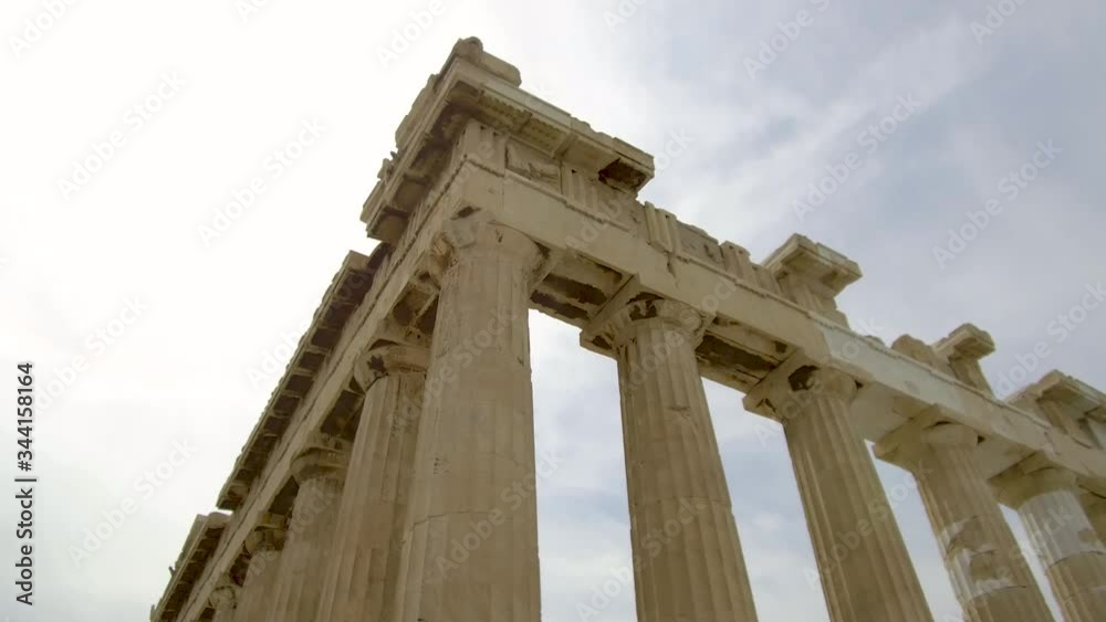 Tracking shot camera moves slowly around ruins of ancient parthenon acropolis in Athens Tracking shot camera moves slowly around ruins of ancient parthenon acropolis in Athens