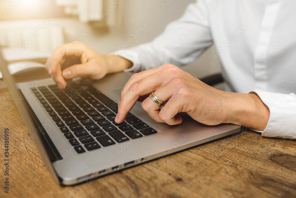Close-up of businessman hands working on laptop typing on keyboard. Close-up of businessman hands working on laptop typing on keyboard.