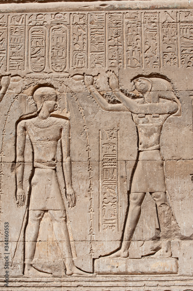 Hieroglyphic carvings on an ancient egyptian temple wall Hieroglyphic carvings on an ancient egyptian temple wall