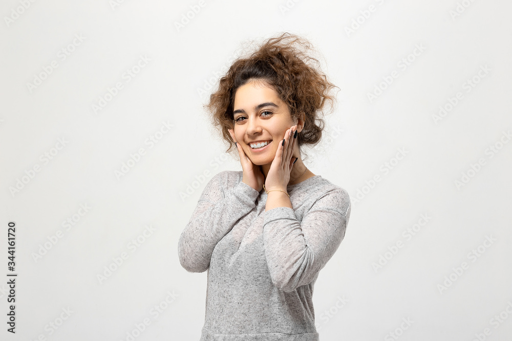 Beautiful young woman portrait. Indoor portrait of beautiful brunette young woman with shaggy hairstyle Beautiful young woman portrait. Indoor portrait of beautiful brunette young woman with shaggy hairstyle