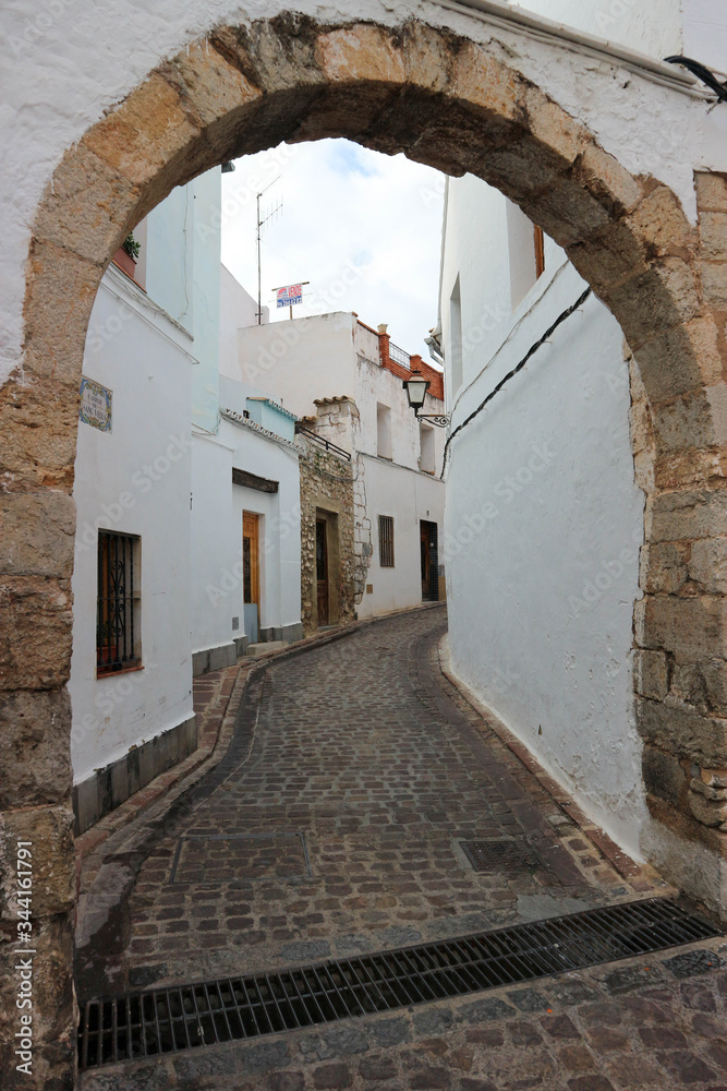 on the empty cosy narrow street in the medieval old town of sagunto, Spain