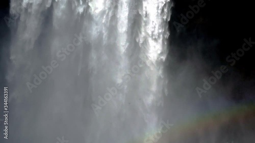 Iceland waterfall Skogafoss in Icelandic nature landscape. Famous tourist attractions and landmarks destination in Icelandic nature landscape on South Iceland.
