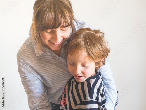 Young mother and child having fun together. Mothers day concept