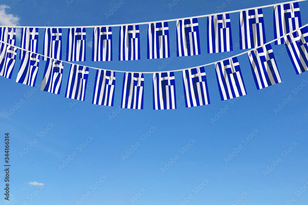 Fototapeta premium Greece flag festive bunting hanging against a blue sky. 3D Render