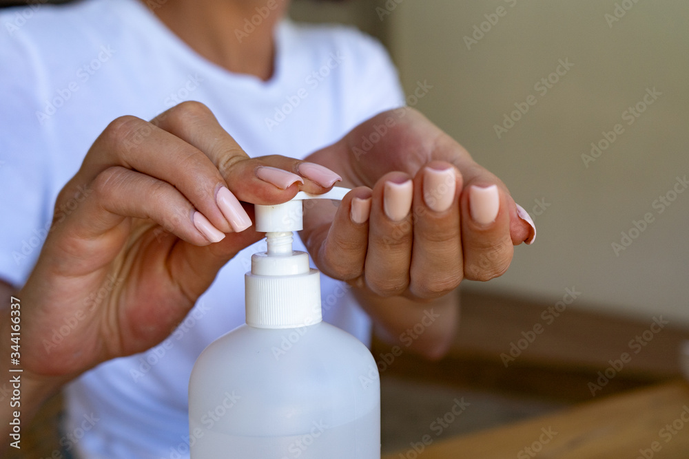 close up of female hands disinfection by sanitizer, covid-19 concept close up of female hands disinfection by sanitizer, covid-19 concept