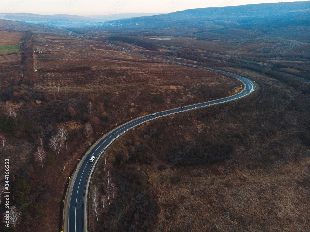 drone view on long road curve