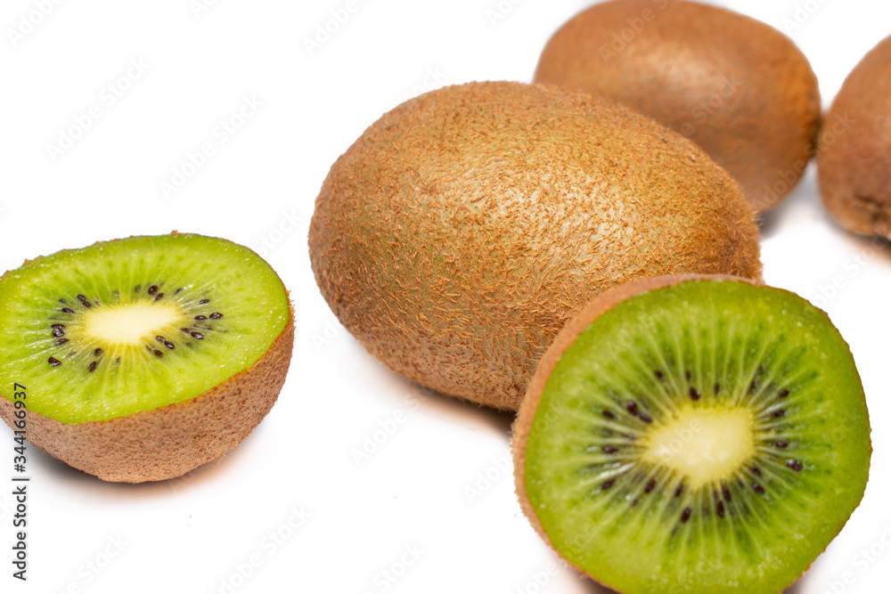 Ripe kiwi on a white background. Fresh green exotic fruit, waiting to be eaten Ripe kiwi on a white background. Fresh green exotic fruit, waiting to be eaten