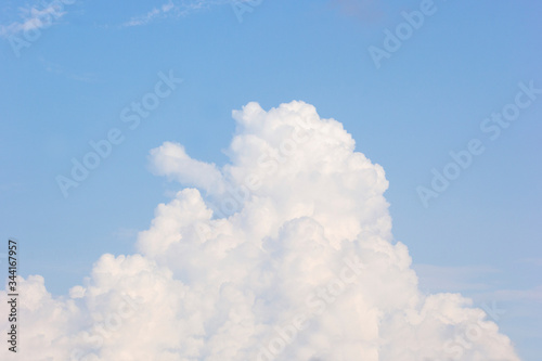 In sunny summer  huge clouds float on the blue sky.Nature weather.