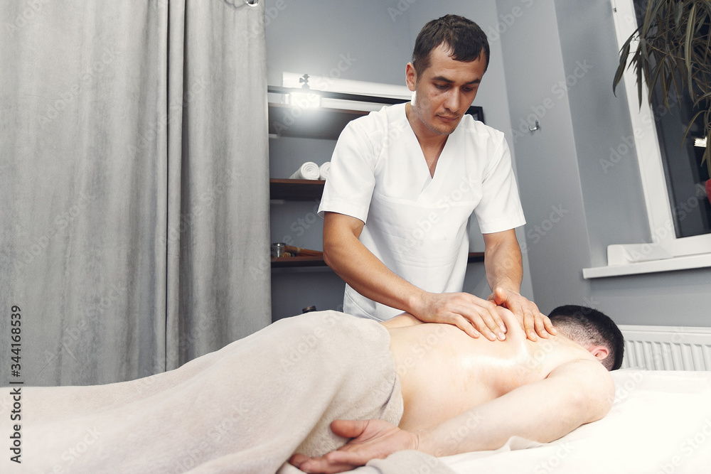 Massage doctor. The man is undergoing rehabilitation Massage doctor. The man is undergoing rehabilitation