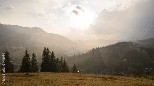 Rural landscape in northern Romania with clouds and rain