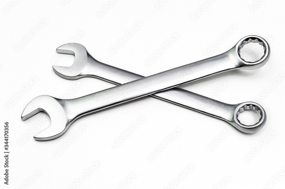 Two chrome spanners of different sizes. Isolated on a white background. Two chrome spanners of different sizes. Isolated on a white background.