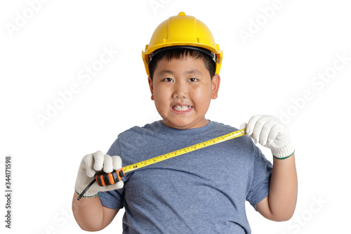 An Asian boy wants to be a mechanic, wear a yellow helmet and wear white gloves with a tape measure. Educational concepts, learning. isolated, Clipping Parts