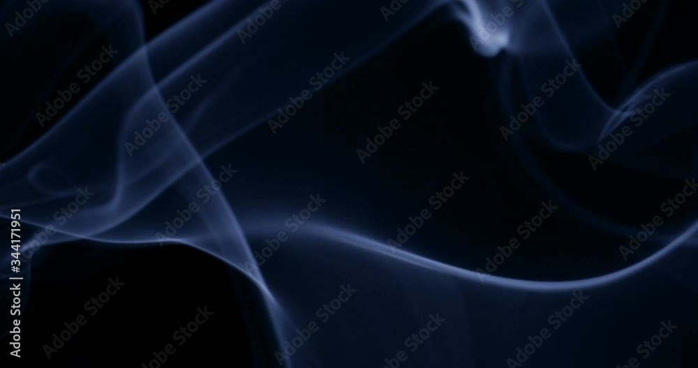 Smoke background. White smoke floating through space against black background Smoke background. White smoke floating through space against black background