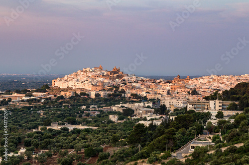 Beautiful view of the city of Ostuni in the sunset rays of the sun. Ostuni, Puglia, Italy