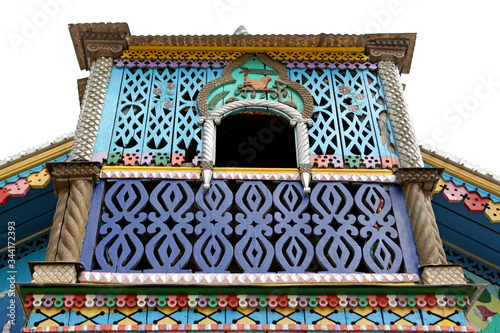 Volkhin's rural wooden house (detail) with ornamental carved windows in Beryozovsky town, Sverdlovsk region, Russia. Russian traditional national folk style in architecture photo