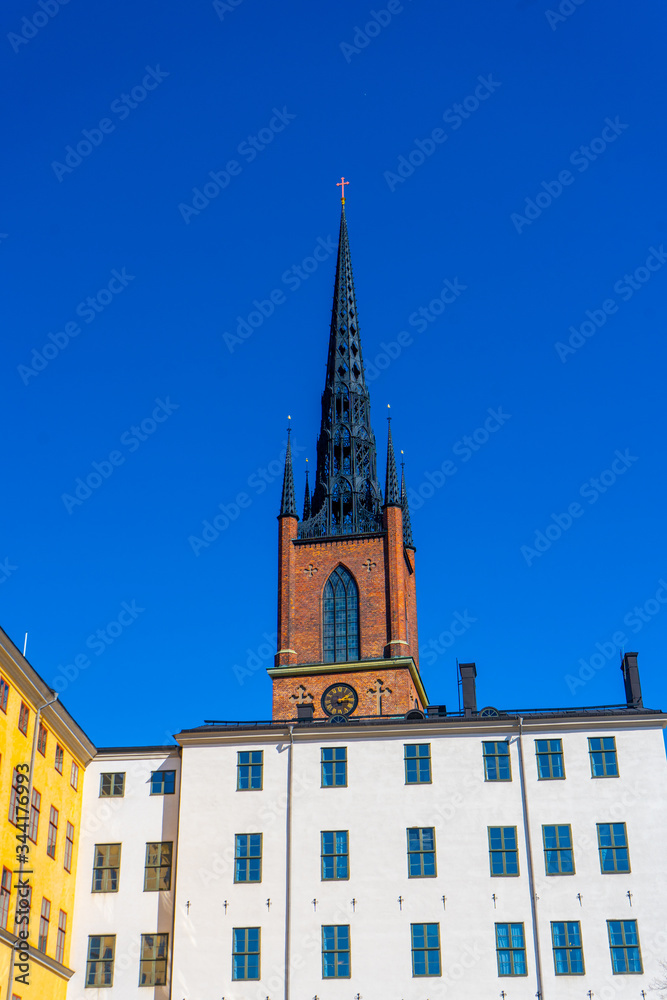 View with Riddarholm Church (Riddarholmskyrkan). Old town in Stockholm. Photo of medieval architecture.