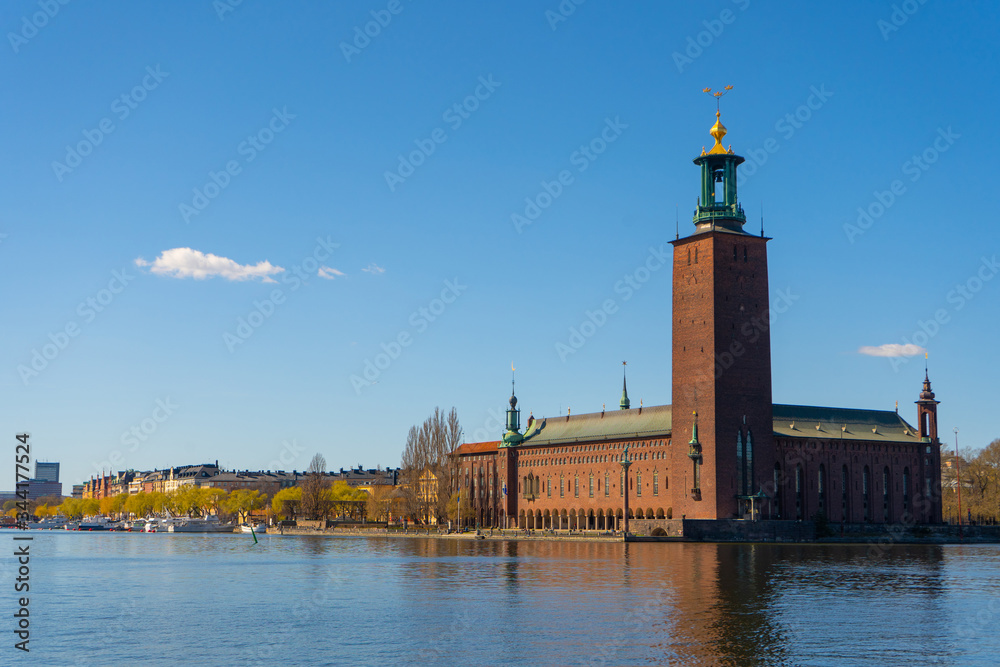 The Stockholm City Hall (Stockholms stadshus). View with Malaren lake from the old town (gamla stan).