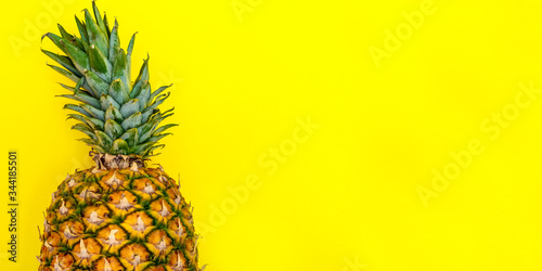 flatlay of pinaple on the yellow background top view, banner with the space for text