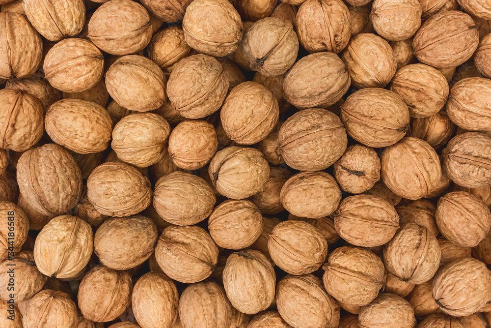 Walnuts background, pile of nuts texture Walnuts background, pile of nuts texture