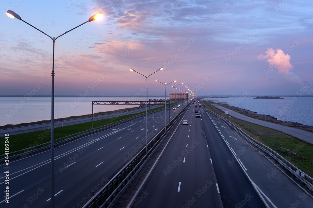 twilights over the dam and highway on it (flood protection complex in St. Petersburg)