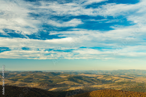 panorama scenery top view highland hill plateau of Carpathian mountains in Ukraine Eastern Europe region June summer day time wallpaper background horizon line with blue sky photo