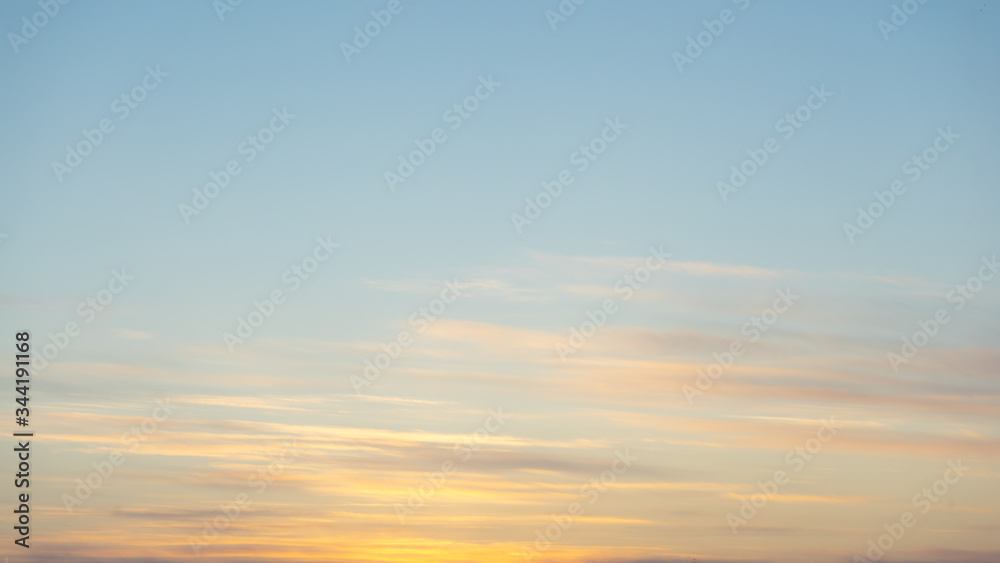 Beautiful clear, morning sky at sunrise, natural background. Soft pink clouds.