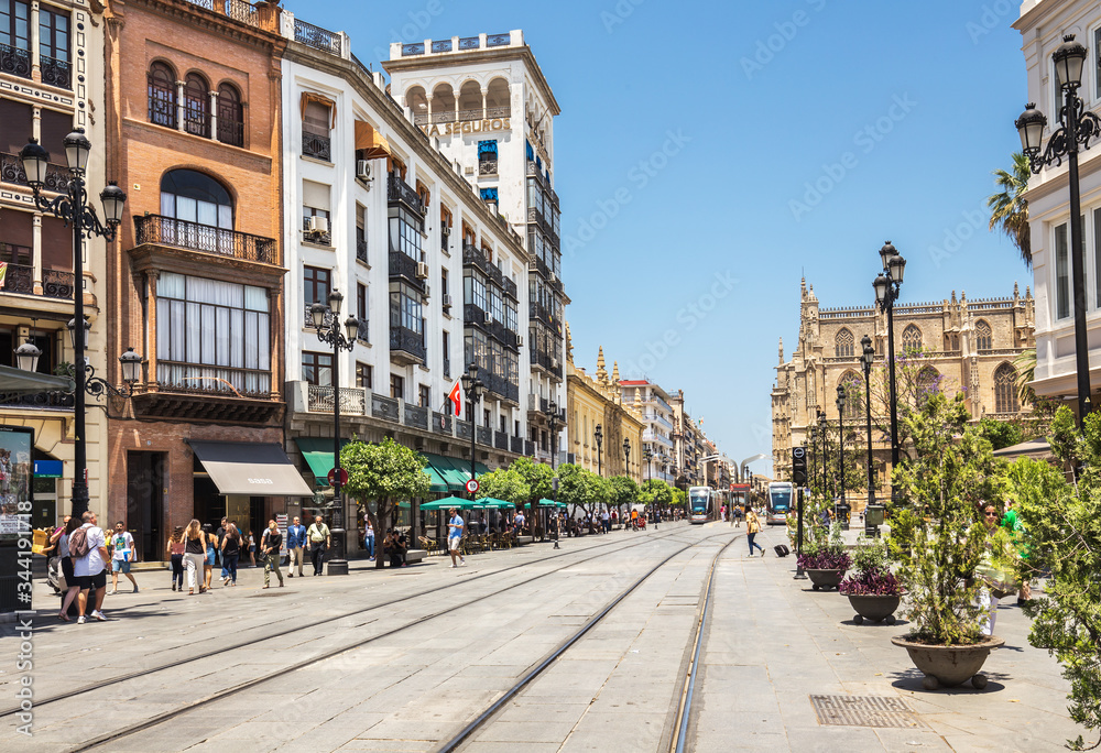 Street with rails for tram in the city center of Seville