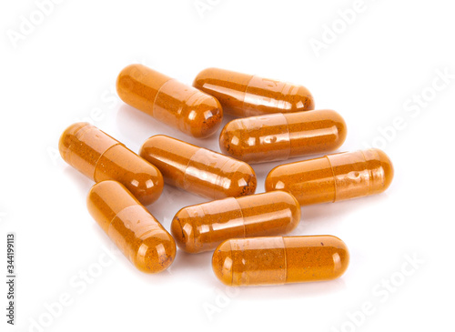 Fotografie capsules of Finely ground dry Turmeric (Curcuma longa Linn) isolated on white background