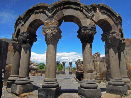 Close up view onto colonnade of ancient Armenian cathedral Zvartnotz located at edge of Vagharshapat (Etchmiadzin), Armenia. Built in 650s AD, collapsed during earthquake in 10 century photo
