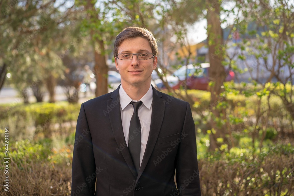 Young business man with sunglasses in the nature Young business man with sunglasses in the nature
