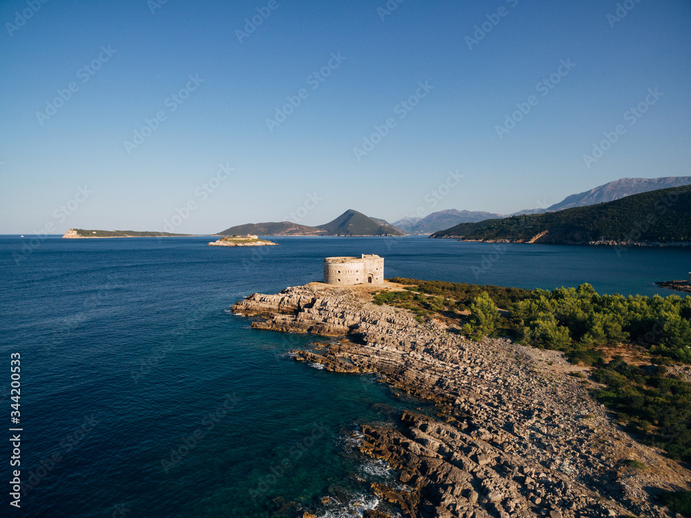 Fort Arza in the Bay of Kotor in Montenegro, in the Adriatic Sea, on the peninsula of Lustica. Fortress for military defense. Aerial photo from the drone. View of Mamula Island
