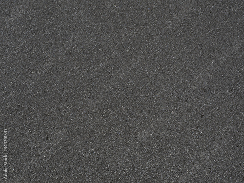 Black micro sponge texture. Soft rubber material background with a high resolution suitable for graphic, top view.
