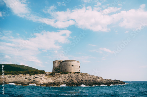 The ancient Austro-Hungarian fort Arza at the entrance to the Bay of Kotor in Montenegro  in the Adriatic Sea  on Lustica peninsula. Fortress for military defense. Stone tower built in 19th century.