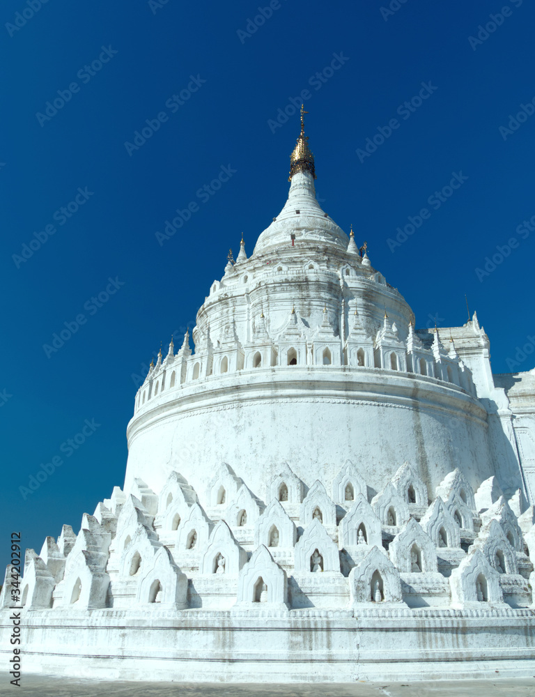The white Hsinbyume Pagoda or Mya Thein Dan pagoda in Mingun city, Myanmar, with blue sky. The white Hsinbyume Pagoda or Mya Thein Dan pagoda in Mingun city, Myanmar, with blue sky.