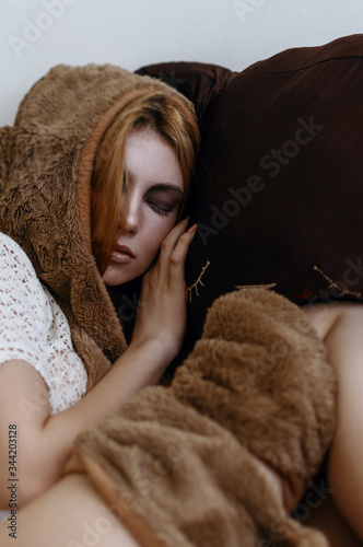 Girl sleep with a big plush cat