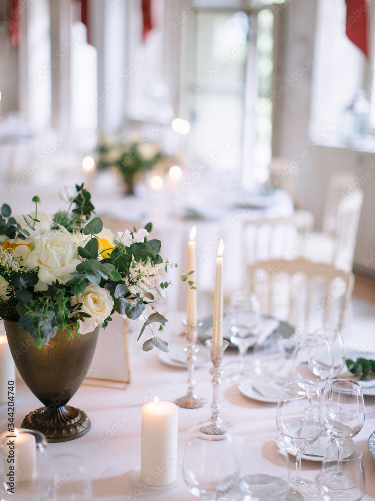 wedding decor, served tables, ivory, with candles, glasses, beautiful wooden tables, inside the Italian old Villa