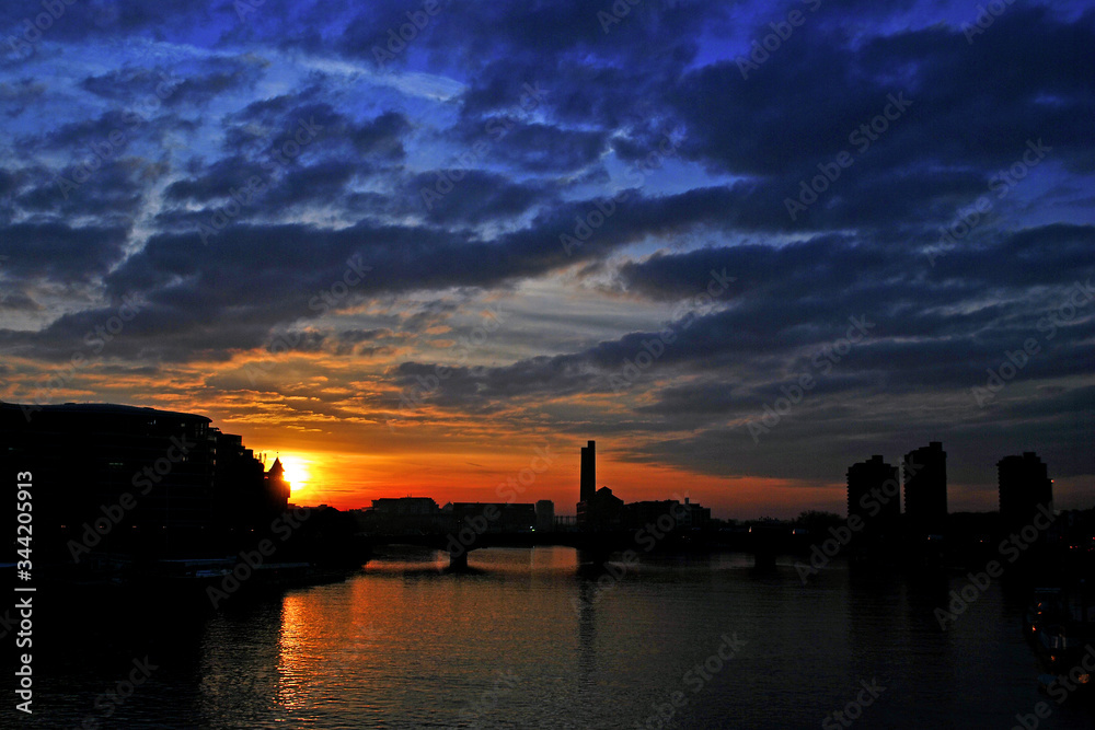 Sunset over the River Thames in Chelsea and Battersea London United Kingdom