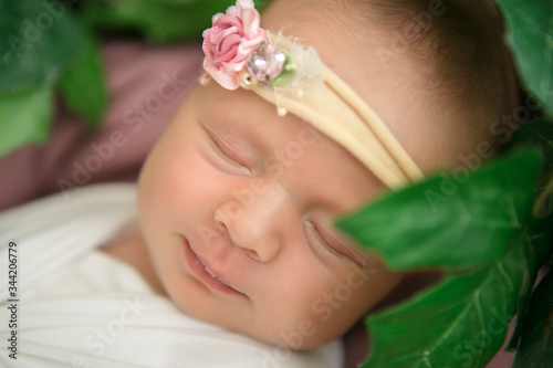 Sleeping beautiful newborn baby girl