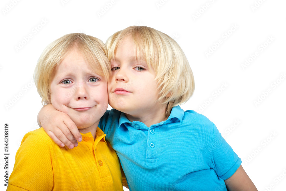 Two caucasian boys brothers posing in studio Two caucasian boys brothers posing in studio