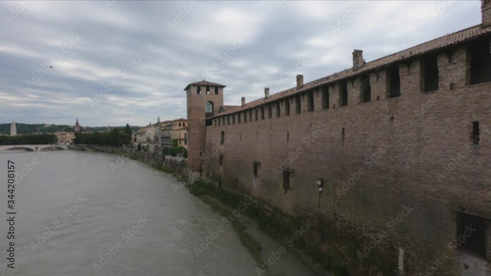 PAN SHOT - View to Verona, Ponte della Vittoria and to the Castelvecchio Tower with River Adige, Italy. PAN SHOT - View to Verona, Ponte della Vittoria and to the Castelvecchio Tower with River Adige, Italy.