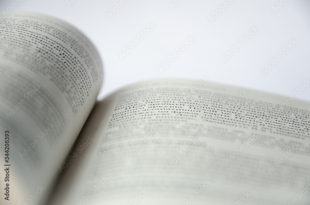 Fototapeta premium An open book with little black text.
