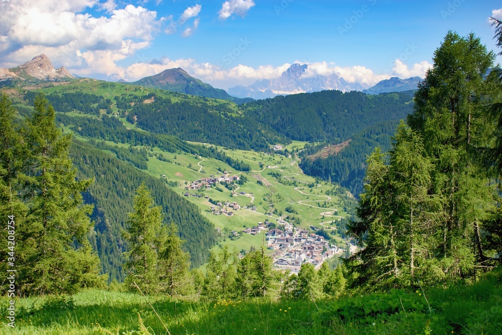 Beautiful summer mountain scenery Corvara di Badia town in the valley,  Dolomites Italy