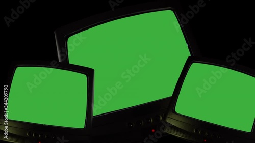 Three vintage TVs on black background, televisions switching on green screen, chroma key screens for pictures, videos or writing. TV screen changing colors, noise static or bad signal reception
